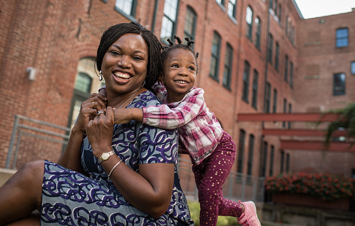 Woman smiling with her daughter