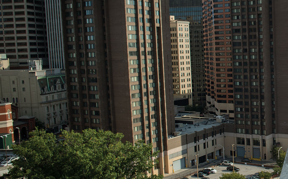 Angled view of green area between buildings from a high angle.