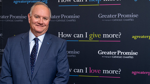 Photo of an official at the event for Catholic Charities