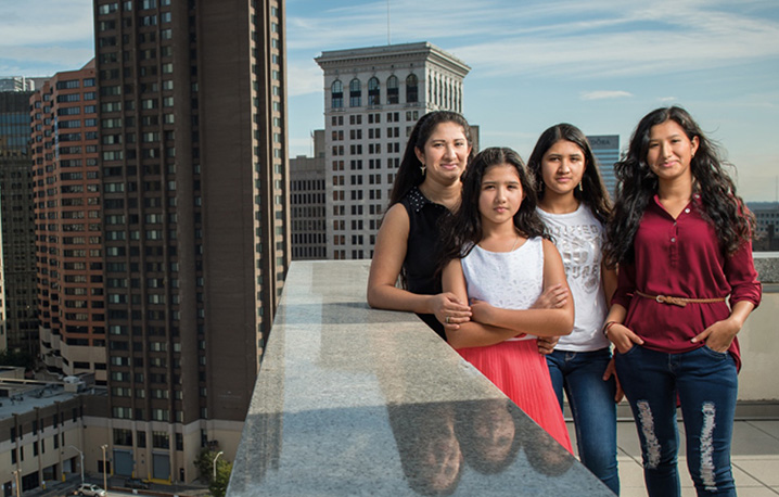 Four women standing on rooftop