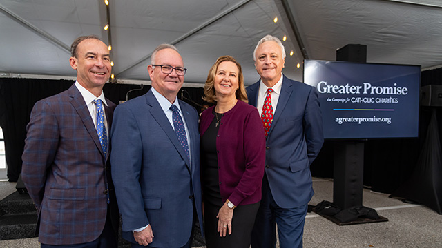 Photo of officials at the event for Catholic Charities